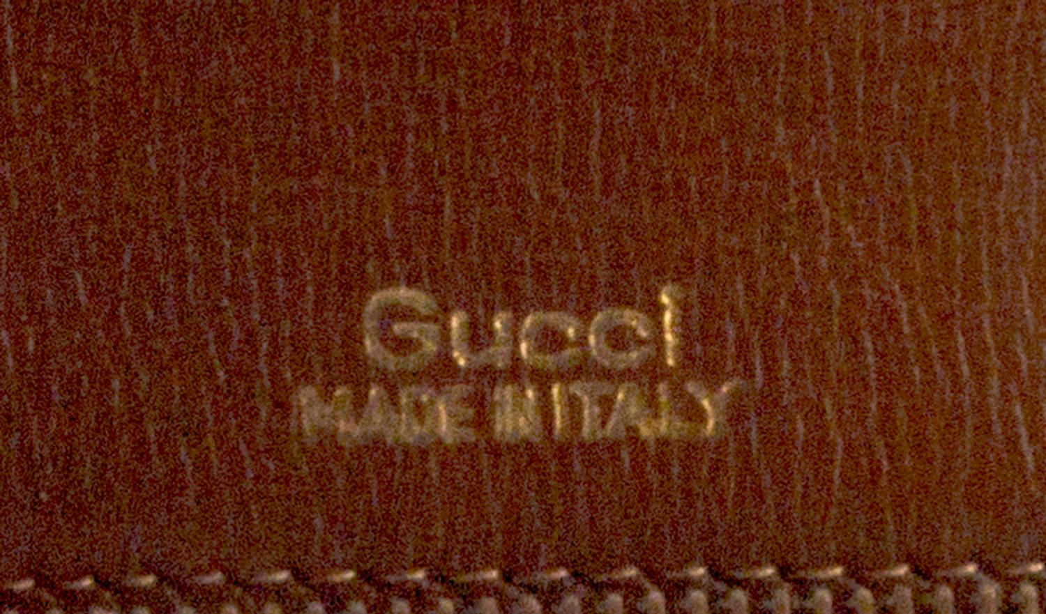 A Gucci Brown Skin Clutch, 10" x 6" x 1.5".