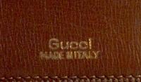 A Gucci Brown Skin Clutch, 10" x 6" x 1.5".