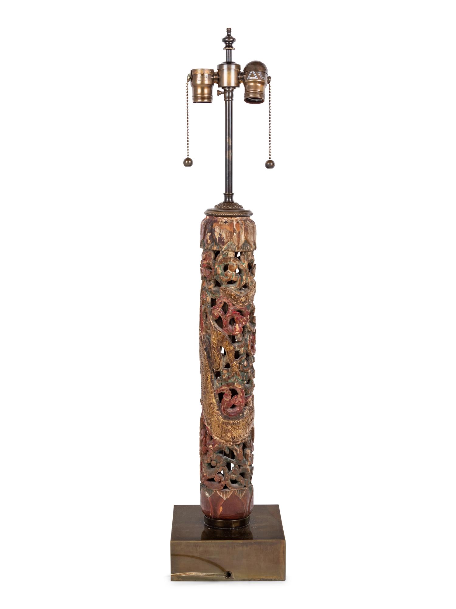A Chinese Pierce Carved, Painted and Gilt Wood Lamp with a Linen Shade