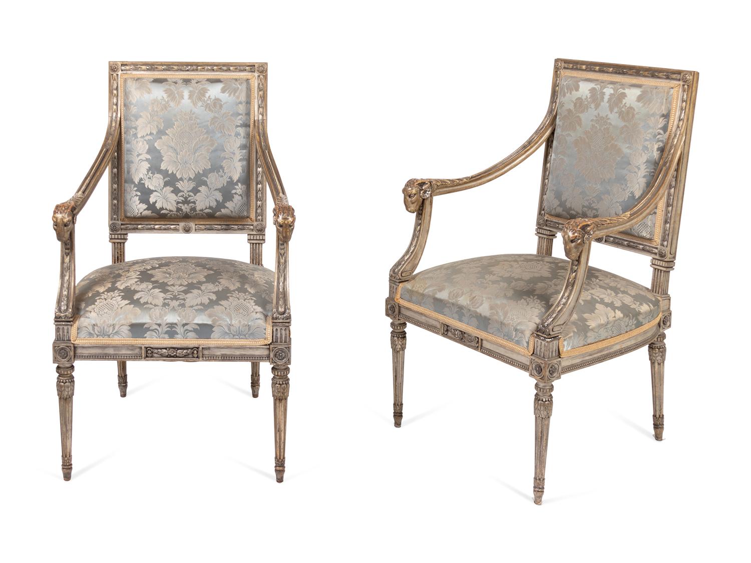 A Pair of Louis XVI Style Carved and Silver Paint Decorated Fauteuils