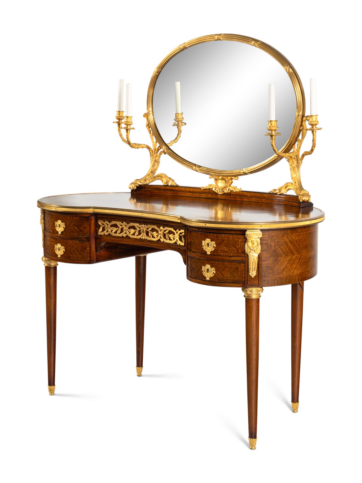 A Louis XVI Style Gilt Bronze Mounted Mahogany Dressing Table and Mirror