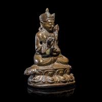 A Tibetan Copper Alloy Seated Figure of Padmasambhava, 16th/17th Century 十六/十七世紀 西藏銅合金銅蓮花生坐像