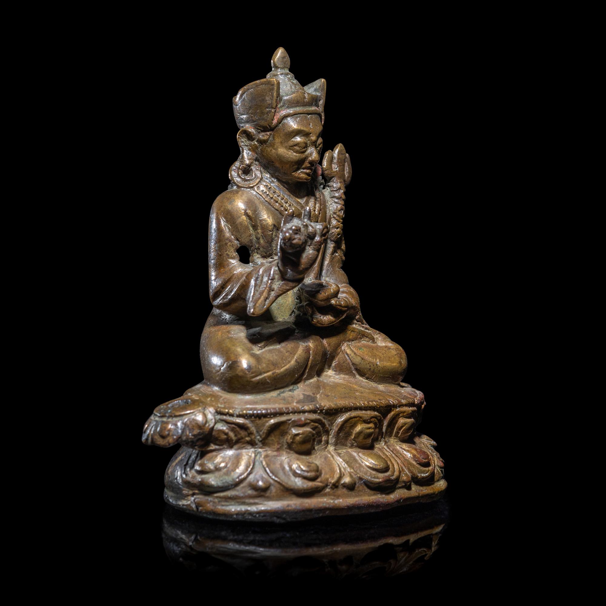 A Tibetan Copper Alloy Seated Figure of Padmasambhava, 16th/17th Century 十六/十七世紀 西藏銅合金銅蓮花生坐像
