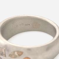 A Platinum and Multi-Colored Diamond Band
