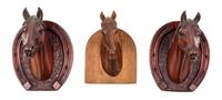 Three Carved Wood Wall Mounts Height of tallest 6 1/2 inches. — ATTRIBUTED TO PETER GIBA, 20TH CENTURY