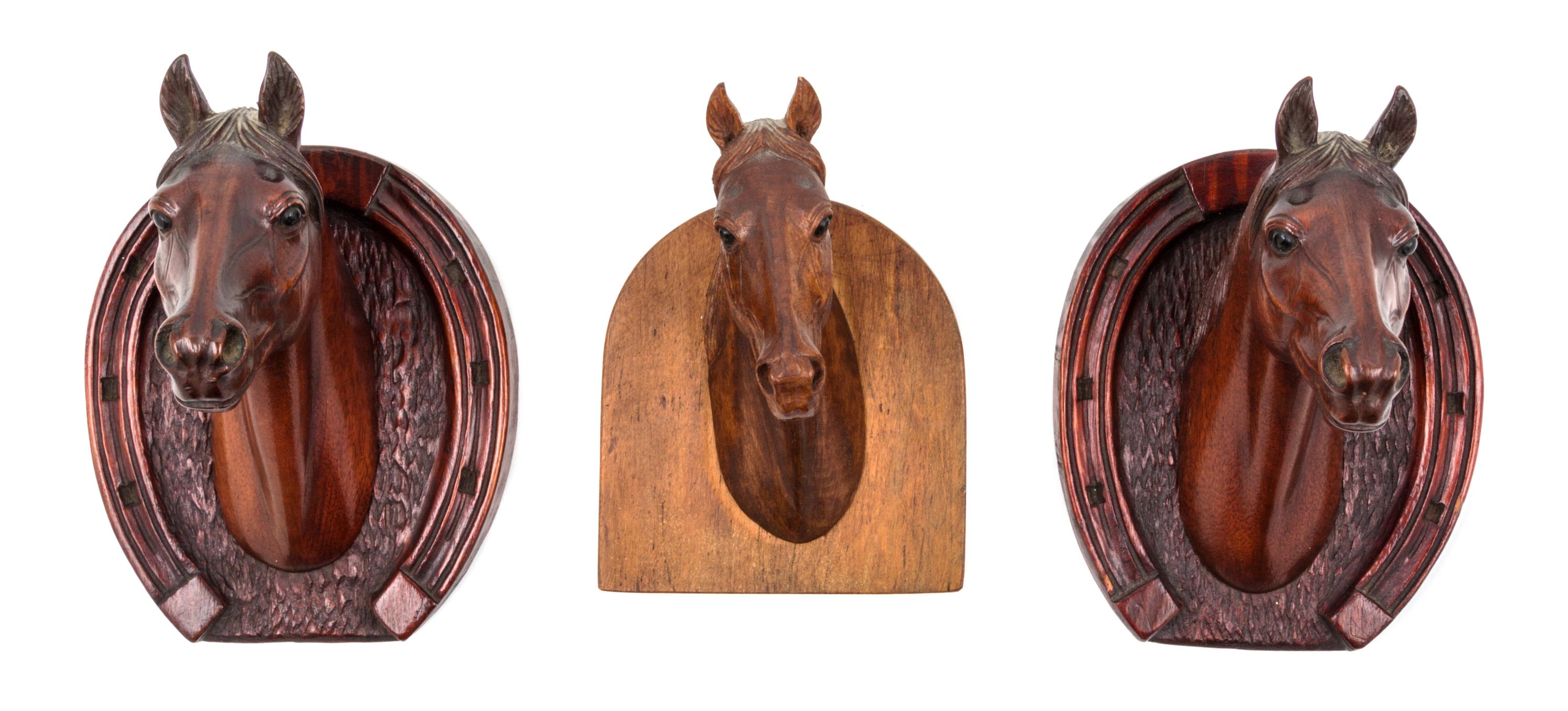 Three Carved Wood Wall Mounts Height of tallest 6 1/2 inches. — ATTRIBUTED TO PETER GIBA, 20TH CENTURY