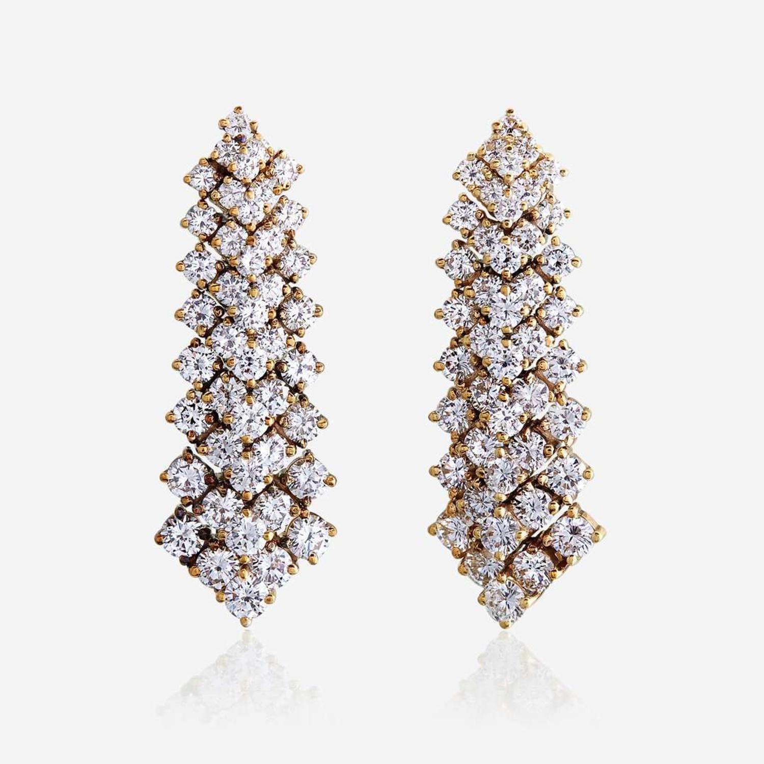 A pair of diamond and eighteen karat gold earrings