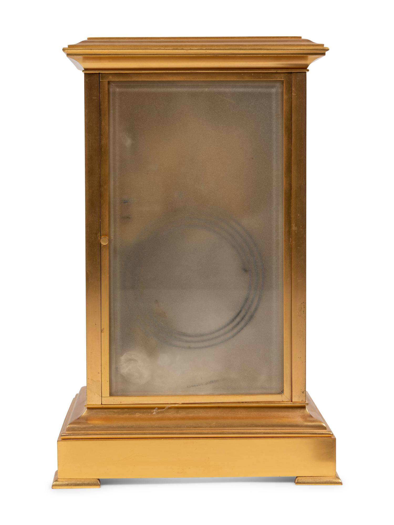 A French Porcelain Inset Gilt Metal Mantel Clock
