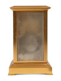 A French Porcelain Inset Gilt Metal Mantel Clock