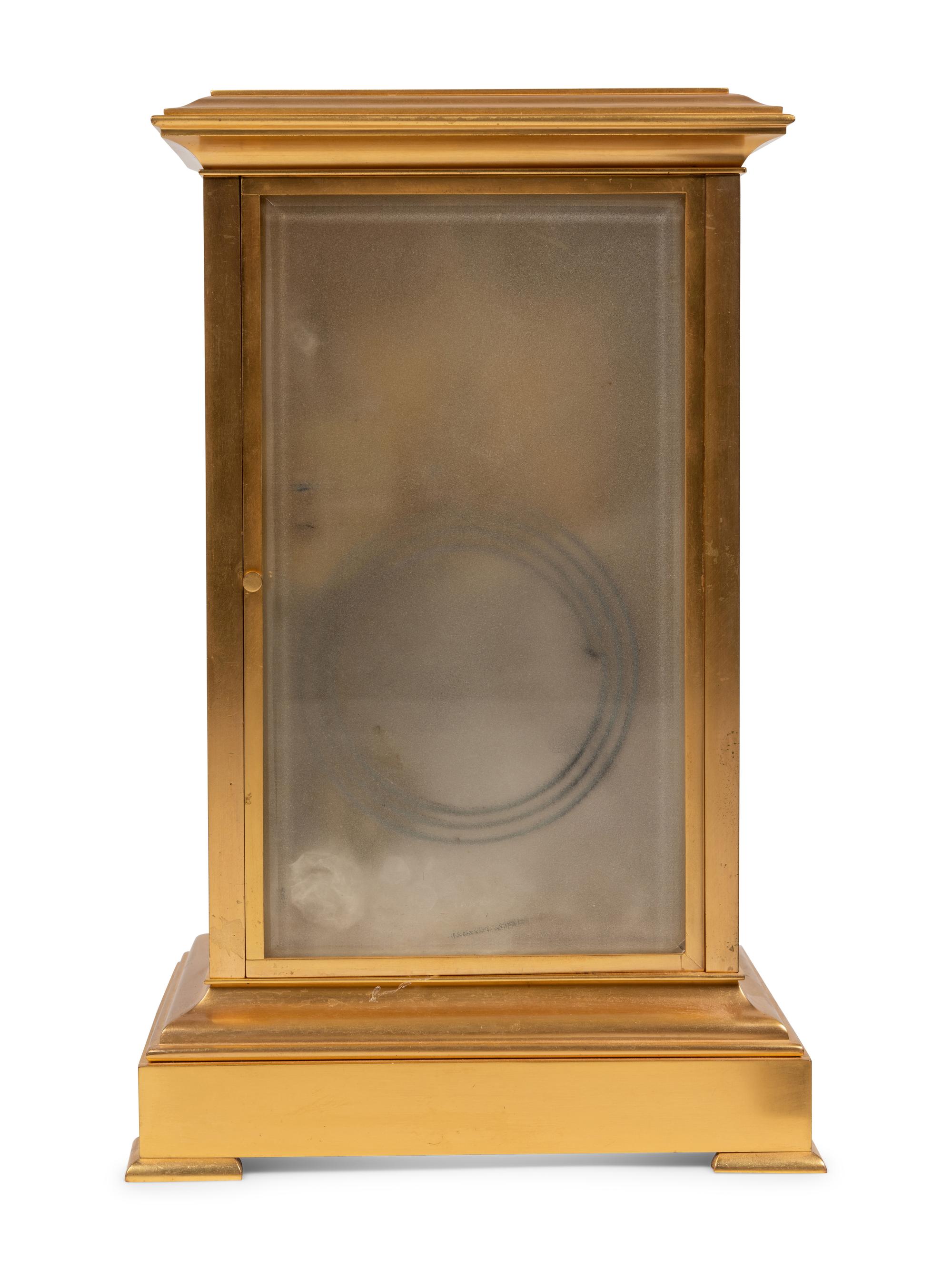 A French Porcelain Inset Gilt Metal Mantel Clock