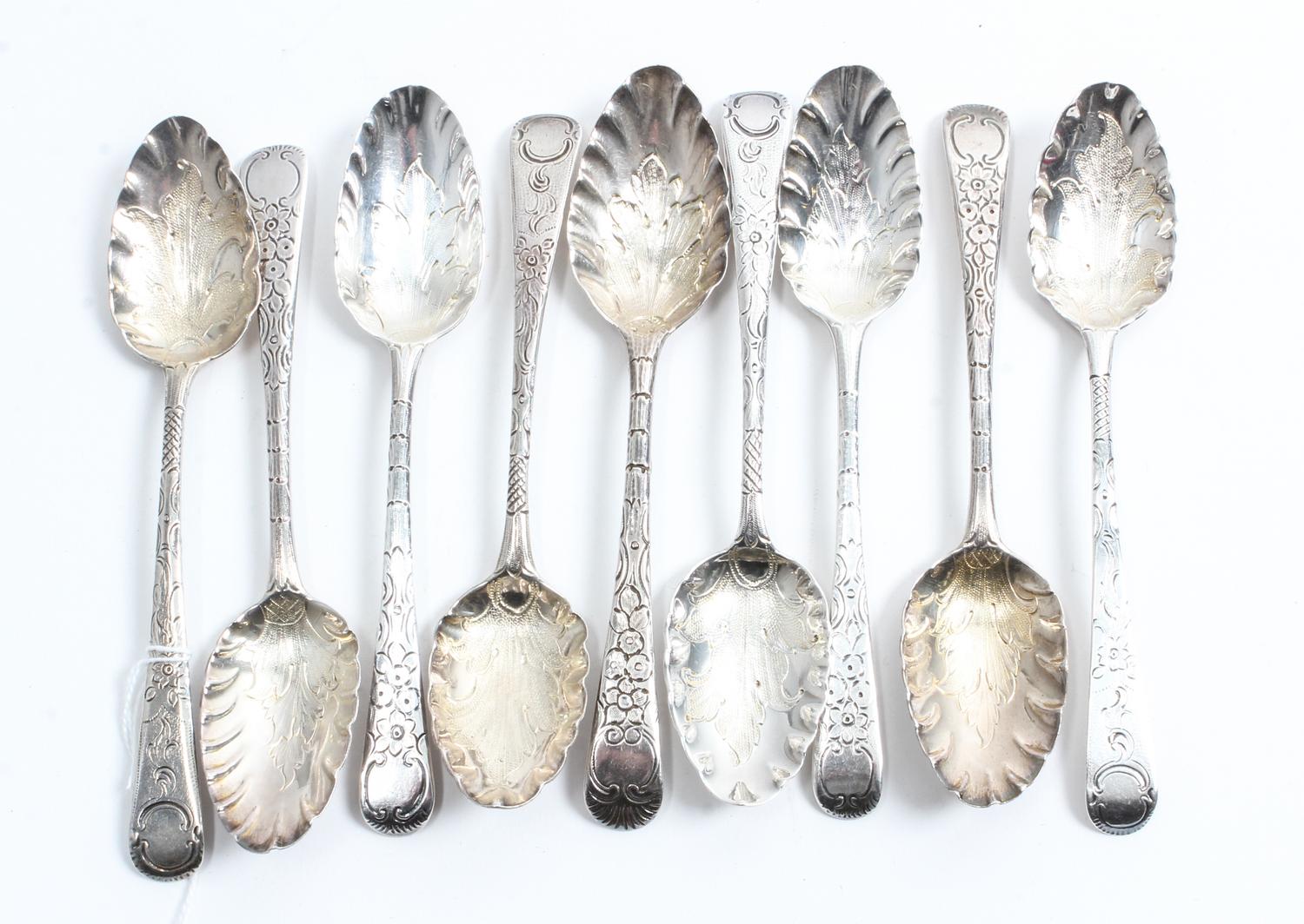 A Group of Nine George III Silver Teaspoons, various makers, the scalloped bowls with stippled foliate decoration, the handles decorate