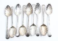 A Group of Nine George III Silver Teaspoons, various makers, the scalloped bowls with stippled foliate decoration, the handles decorate