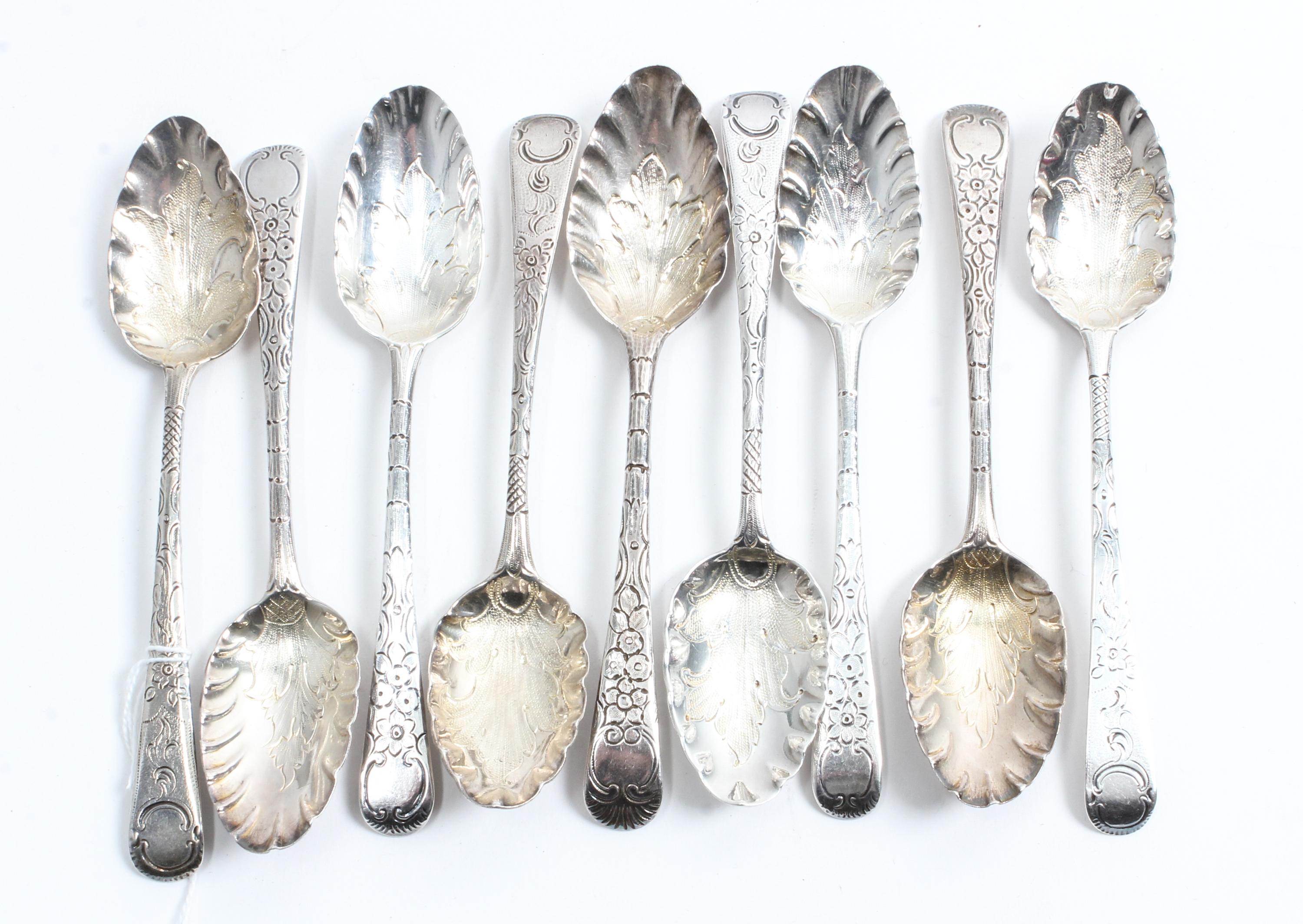 A Group of Nine George III Silver Teaspoons, various makers, the scalloped bowls with stippled foliate decoration, the handles decorate