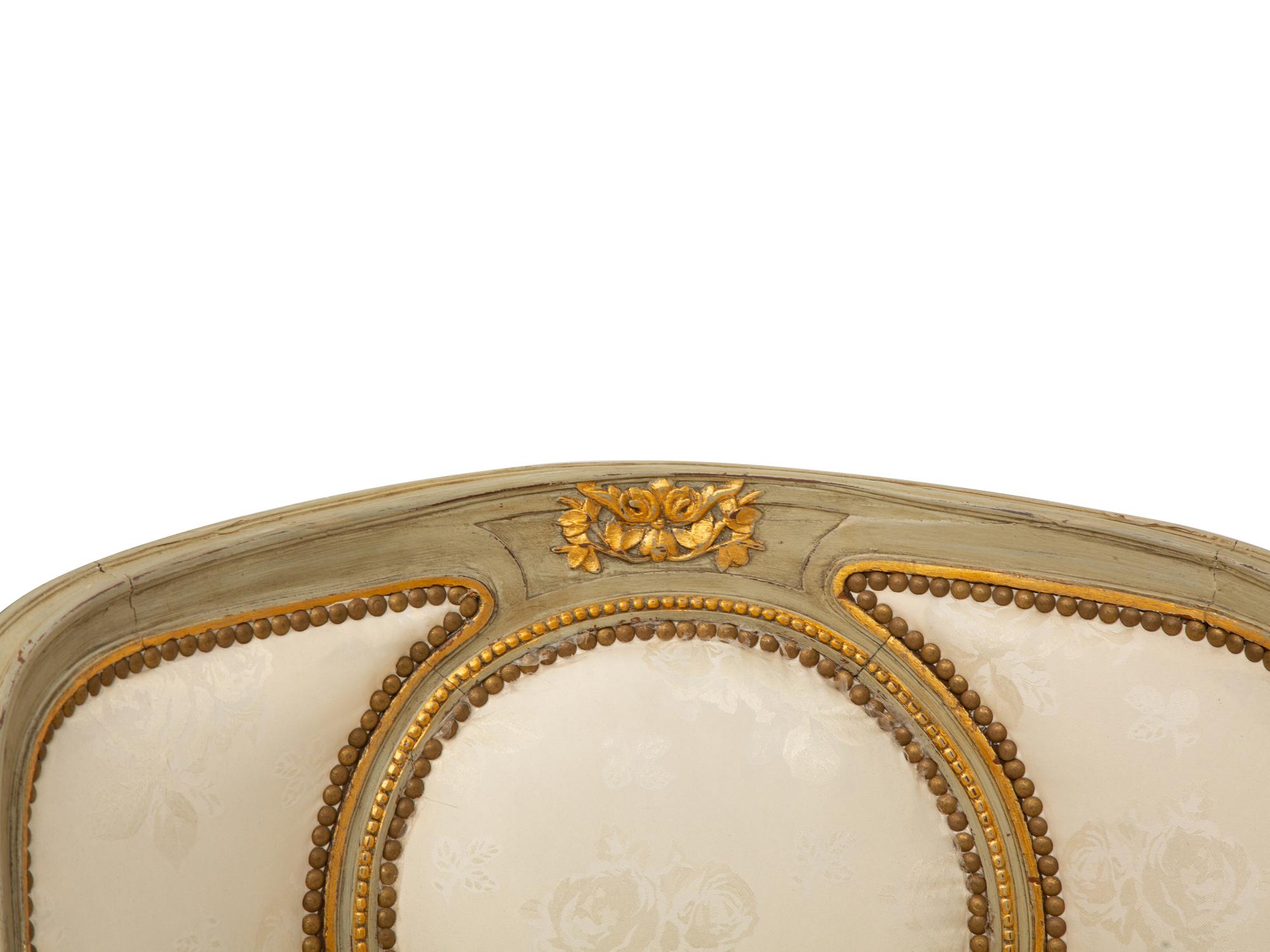 A French Provincial Style Painted and Parcel Gilt Chaise Longue