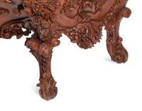 A Continental Floral-Carved and Painted Wood Commode