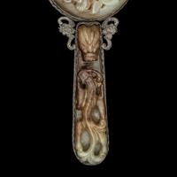 A Chinese White and Russet Jade Inset Hand Mirror and French Mother-of-Pearl Opera Glasses 銅嵌貝母歌劇望遠鏡及銀鑲玉手把鏡