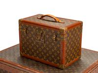 Four Louis Vuitton Hard-Sided Suitcases