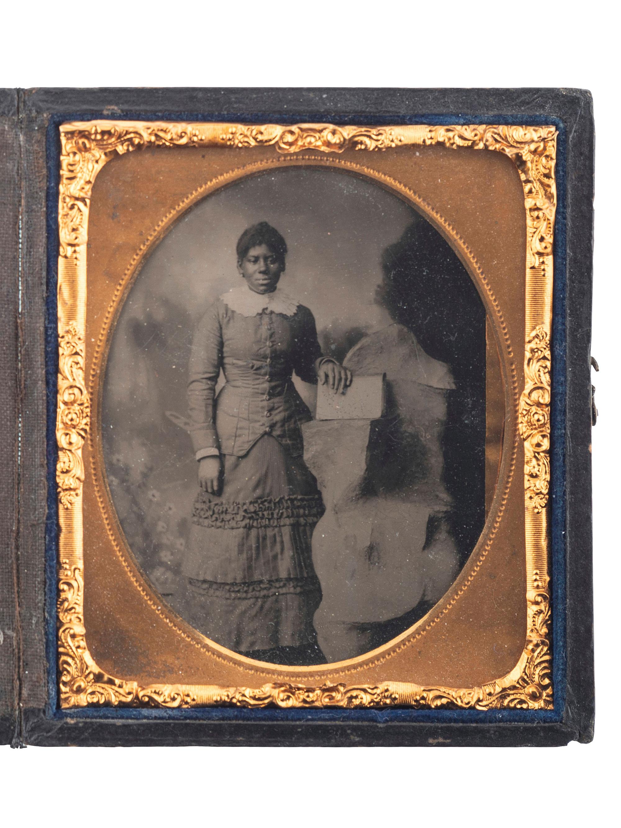 [EARLY PHOTOGRAPHY]. A pair of tintypes of African American subjects, including startled baby, plus: