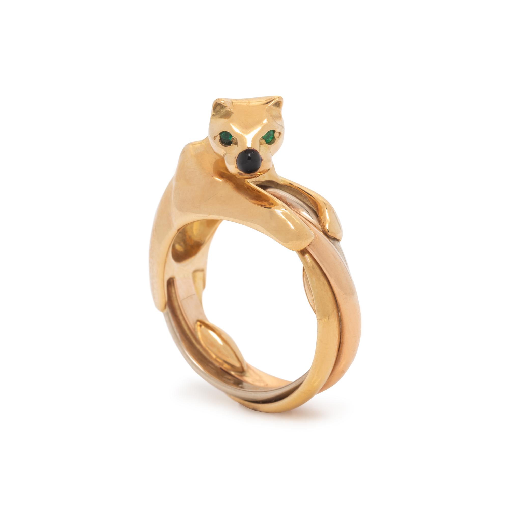 CARTIER, TRICOLOR GOLD, EMERALD AND ONYX 'PANTHÈRE' TRINITY RING