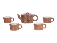 A Chinese Yixing Zisha Pottery Teapot and Four Teacups