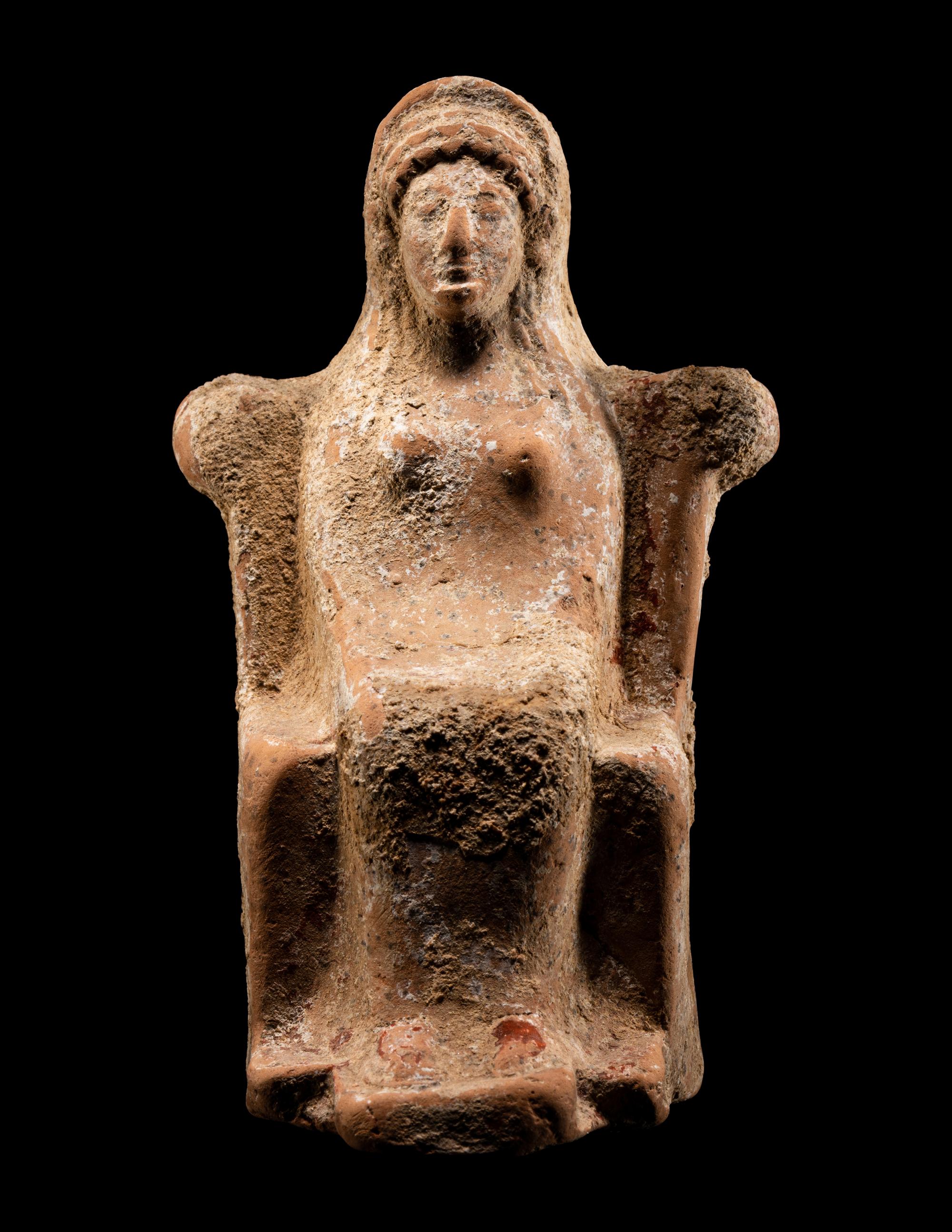 A Greek Terracotta of a Seated Female Deity