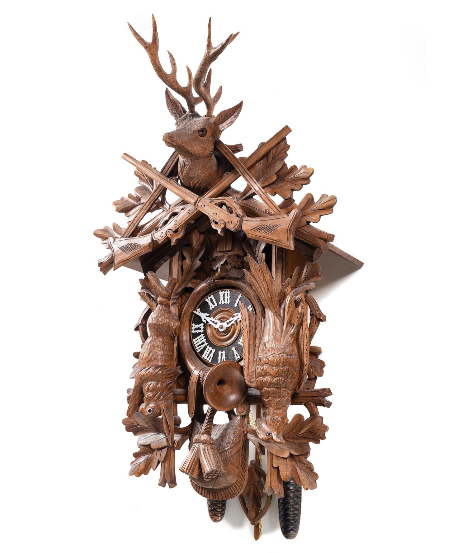 A Black Forest Style Carved Walnut Cuckoo Clock