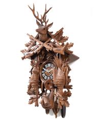 A Black Forest Style Carved Walnut Cuckoo Clock