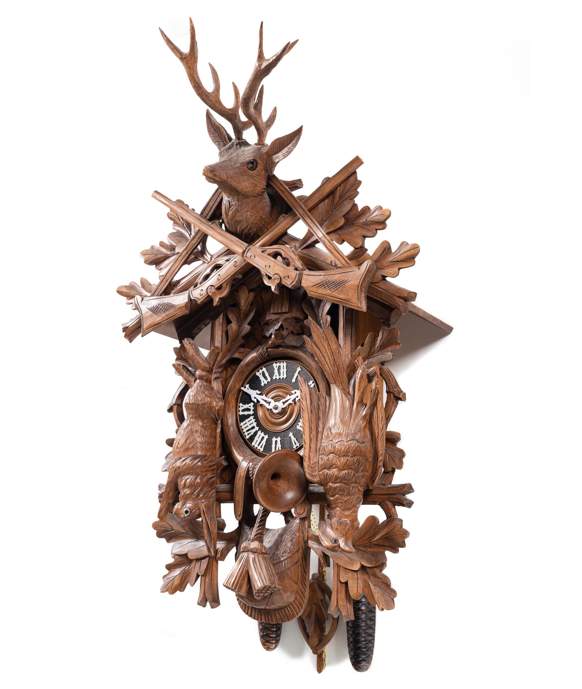 A Black Forest Style Carved Walnut Cuckoo Clock