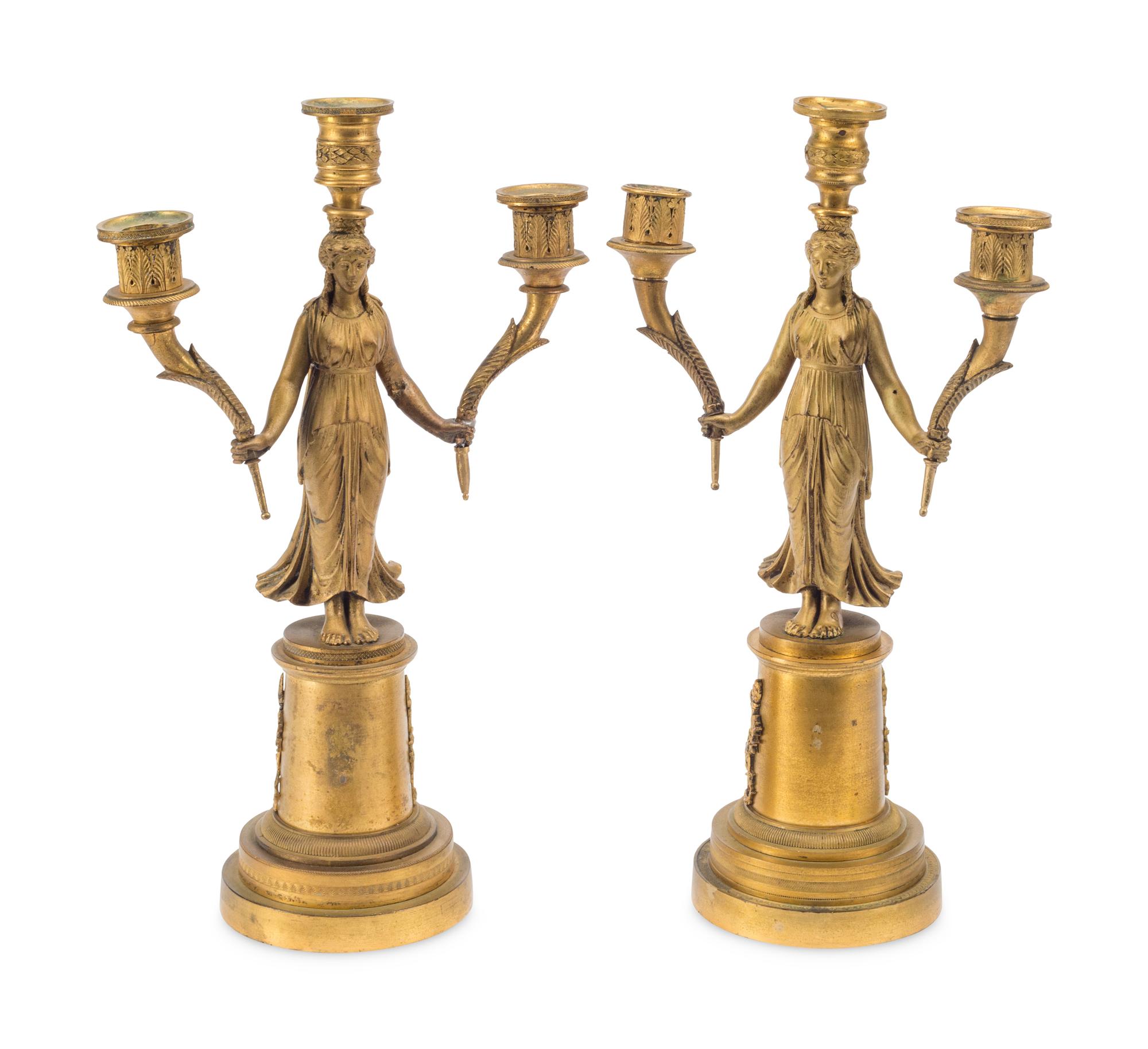 A Pair of Empire Style Gilt Bronze Three-Light Figural Candelabra
