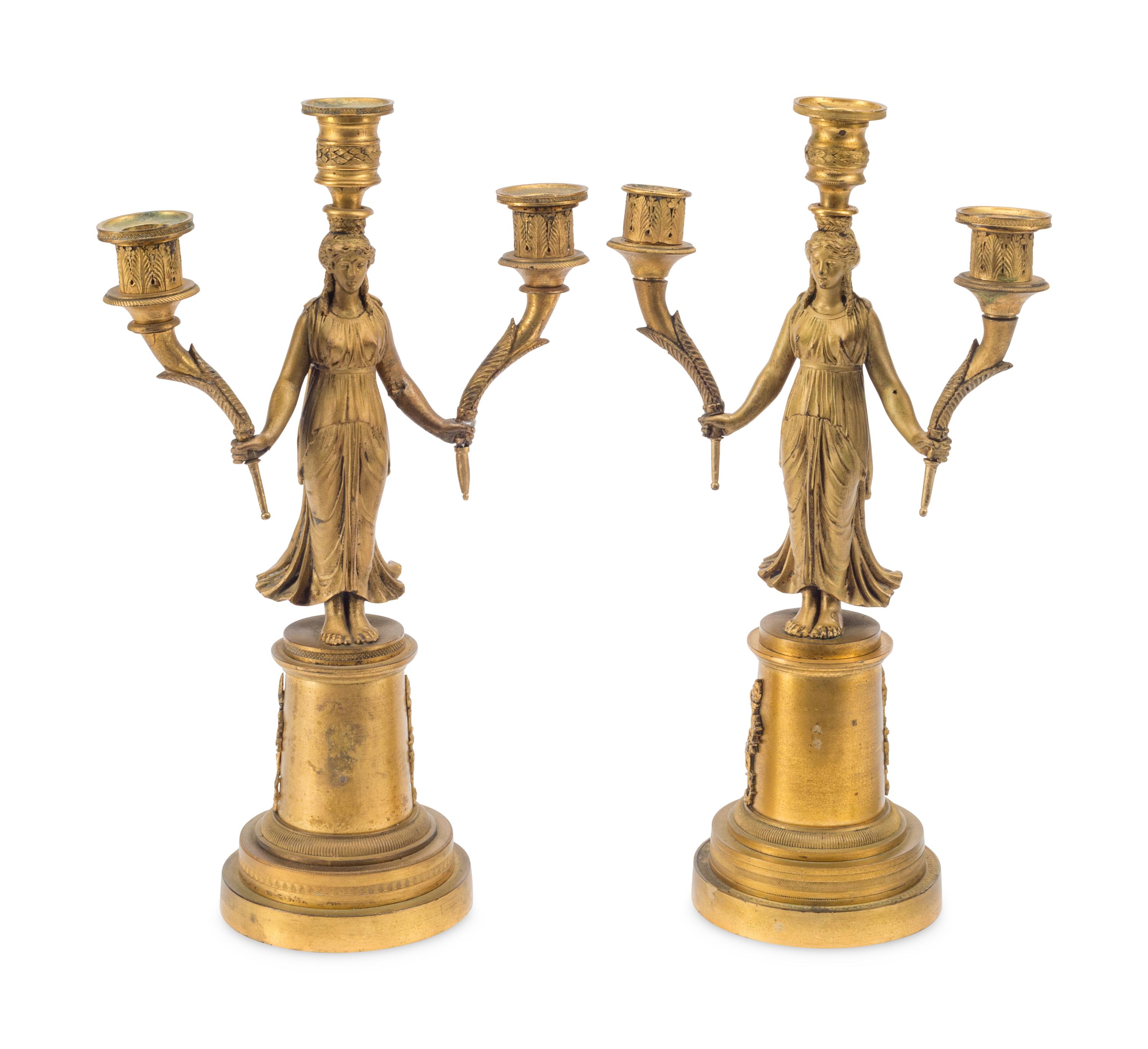 A Pair of Empire Style Gilt Bronze Three-Light Figural Candelabra