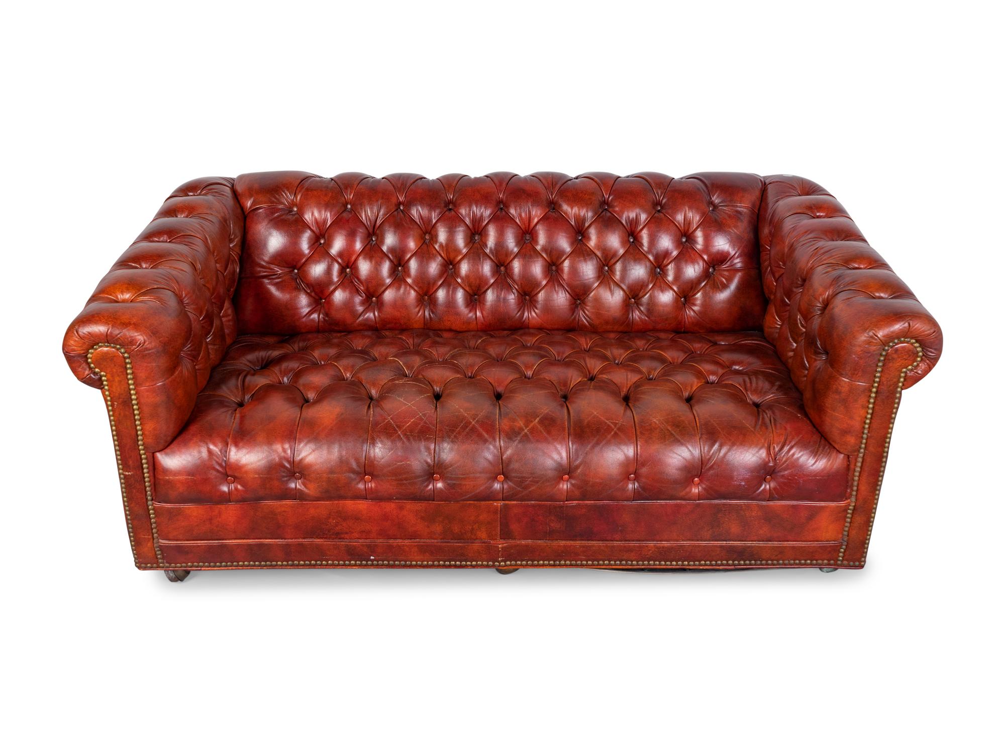 A Chesterfield Style Faux Leather and Brass Studded Sofa and Settee — 20TH CENTURY