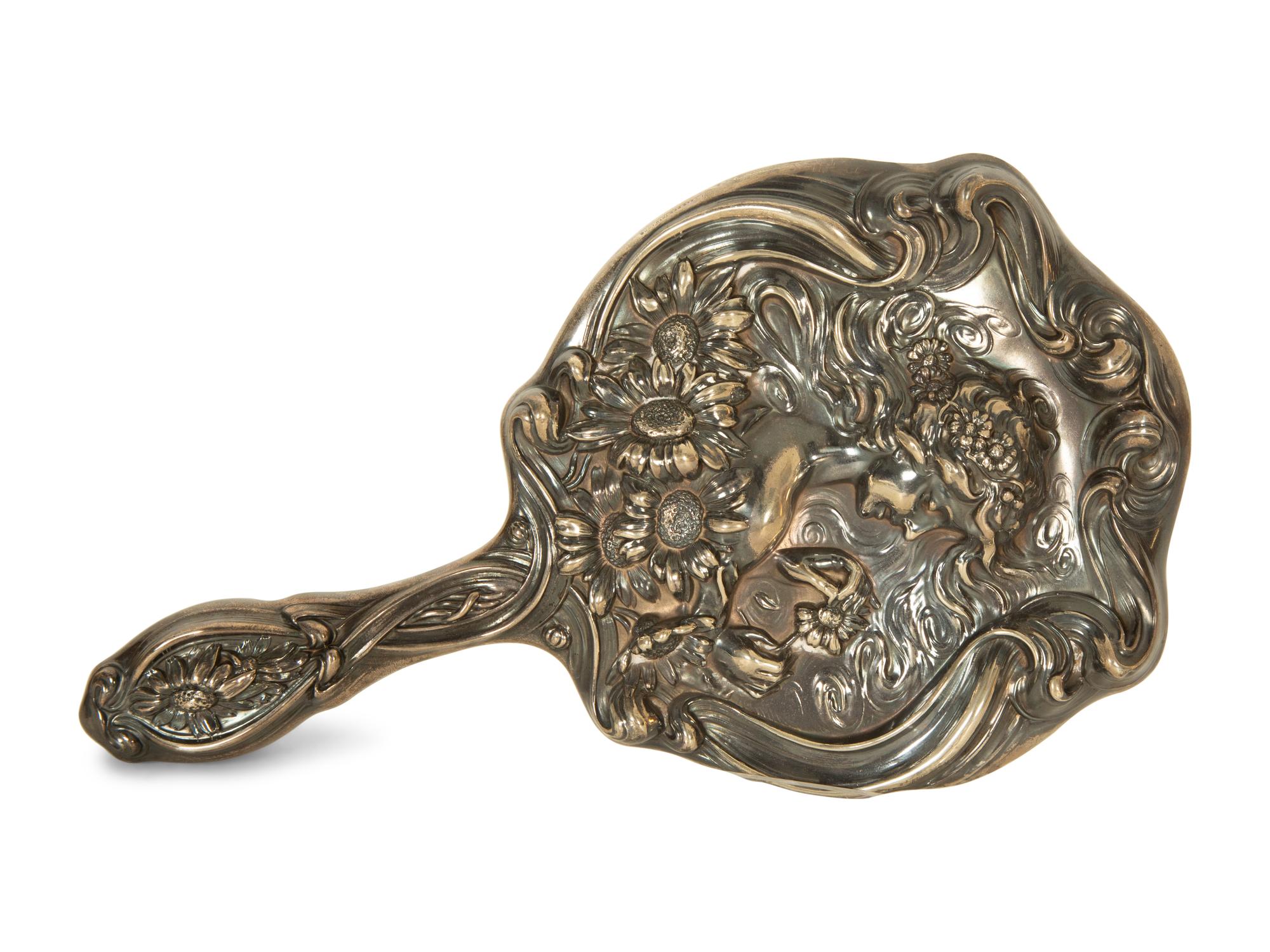 A Silver Hand Mirror and Hairbrush
