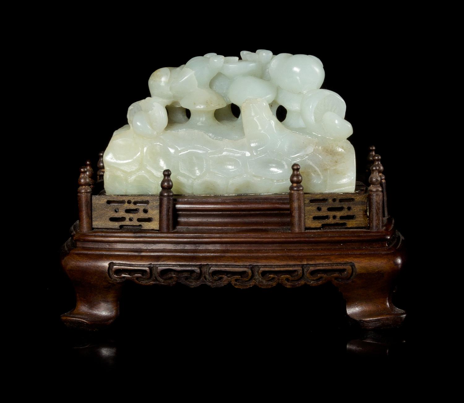 A Celadon Jade Carving Height 2 1/8 x length 3 3/4 x width 1 5/8 inches.