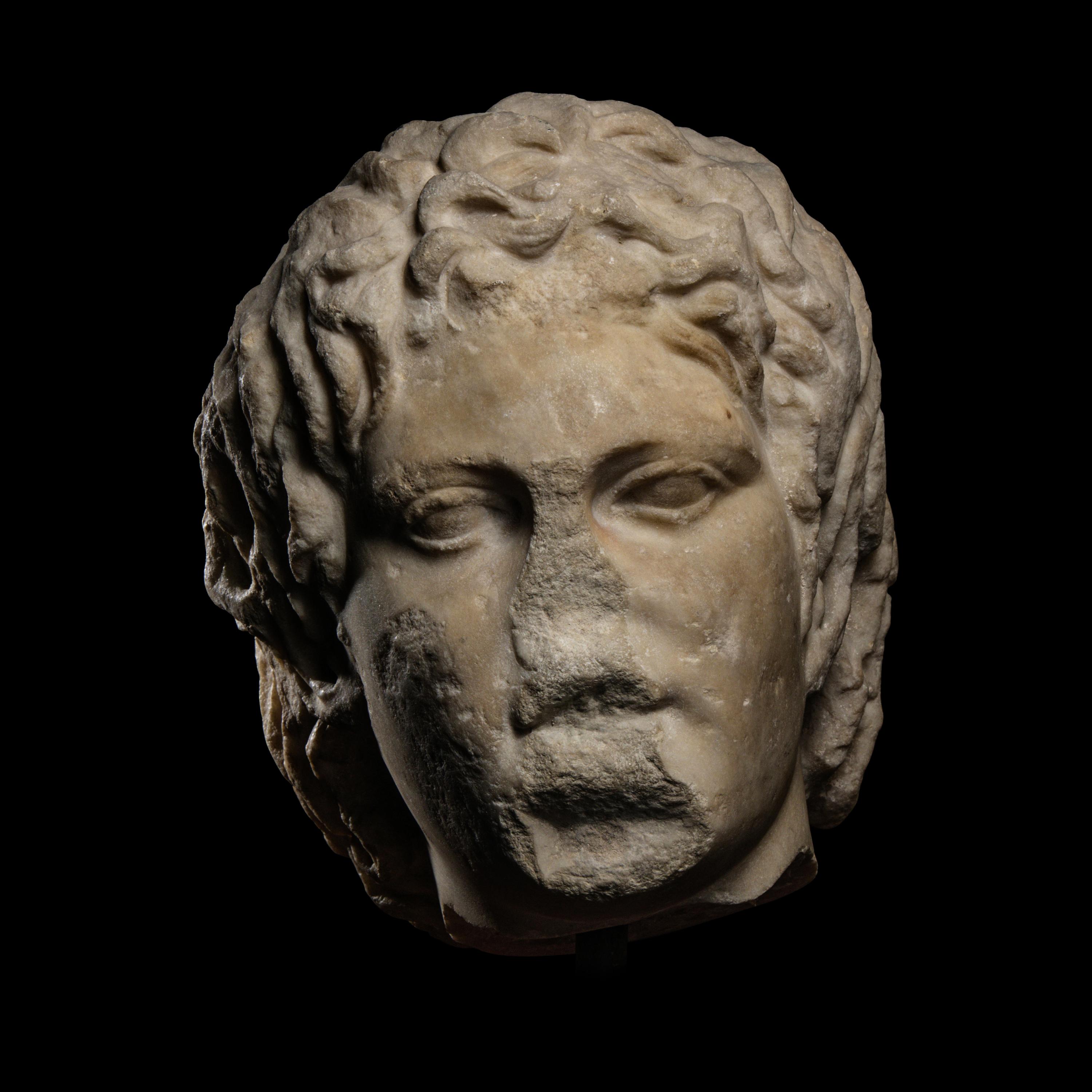 A Roman Marble Head of a Satyr
