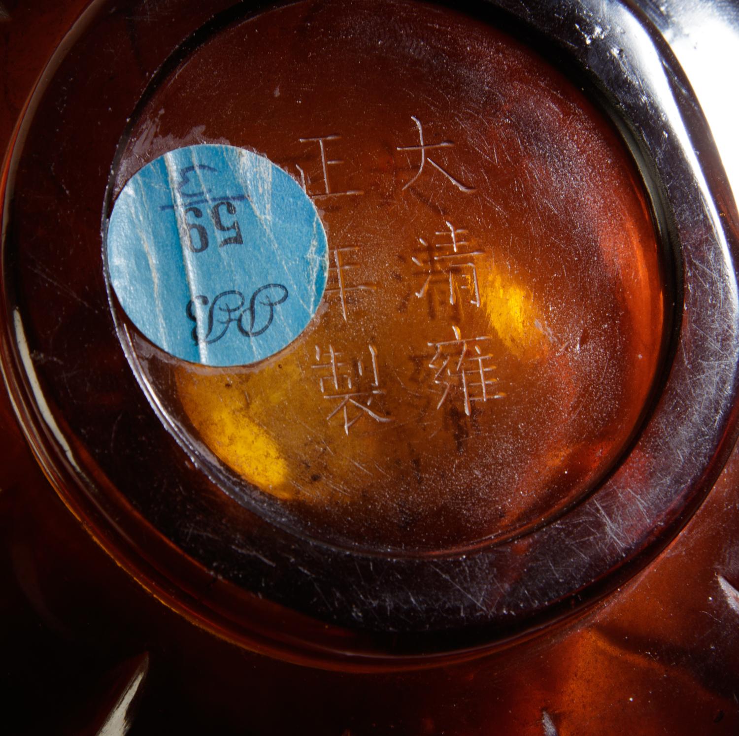 A Transparent Amber-Tone Glass Bottle
