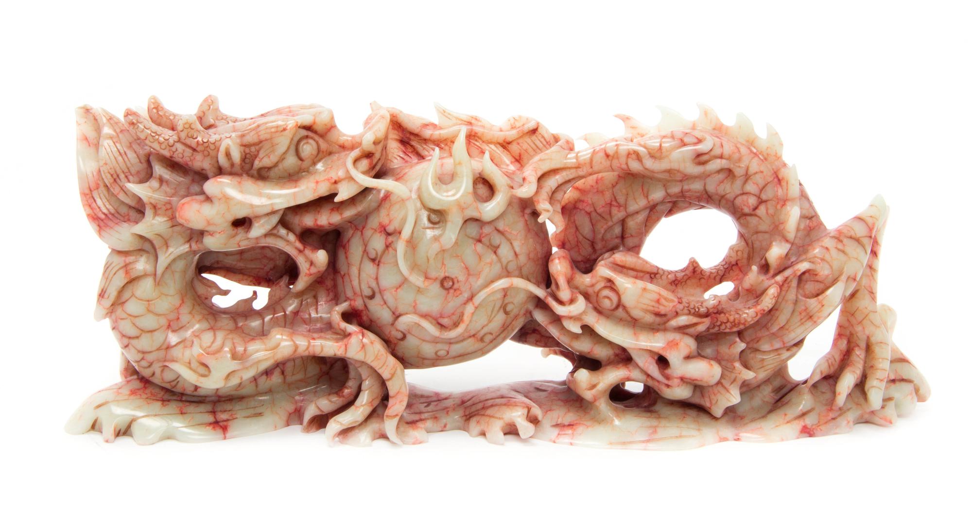 A Chinese Carved Bloodstone Figure Height 6 inches x width 16 inches.
