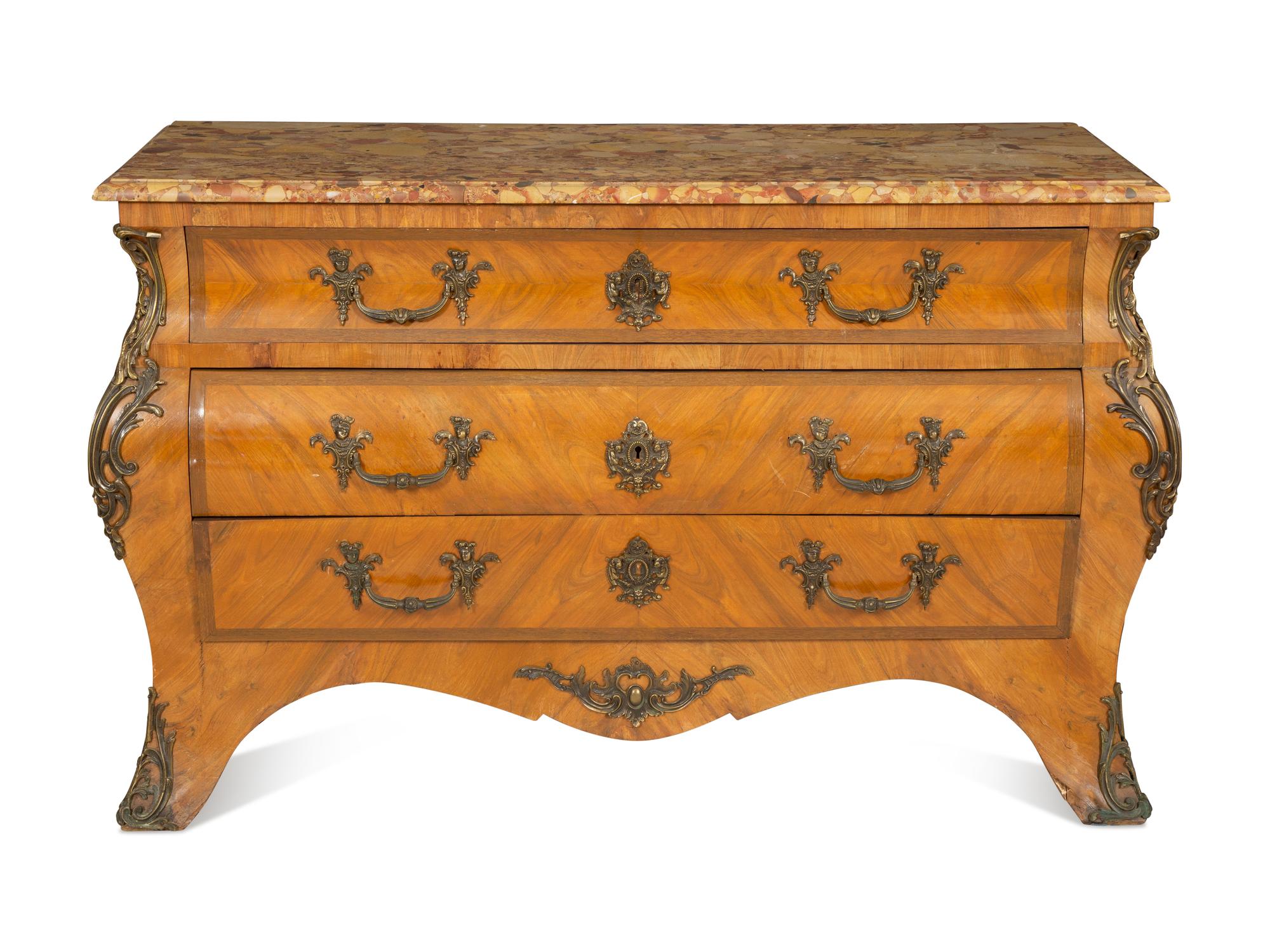 A Régence Style Gilt Metal Mounted Breche d'Alep Marble Top Commode