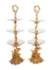 A Pair of French Gilt Bronze and Glass Three-Tier Stands
