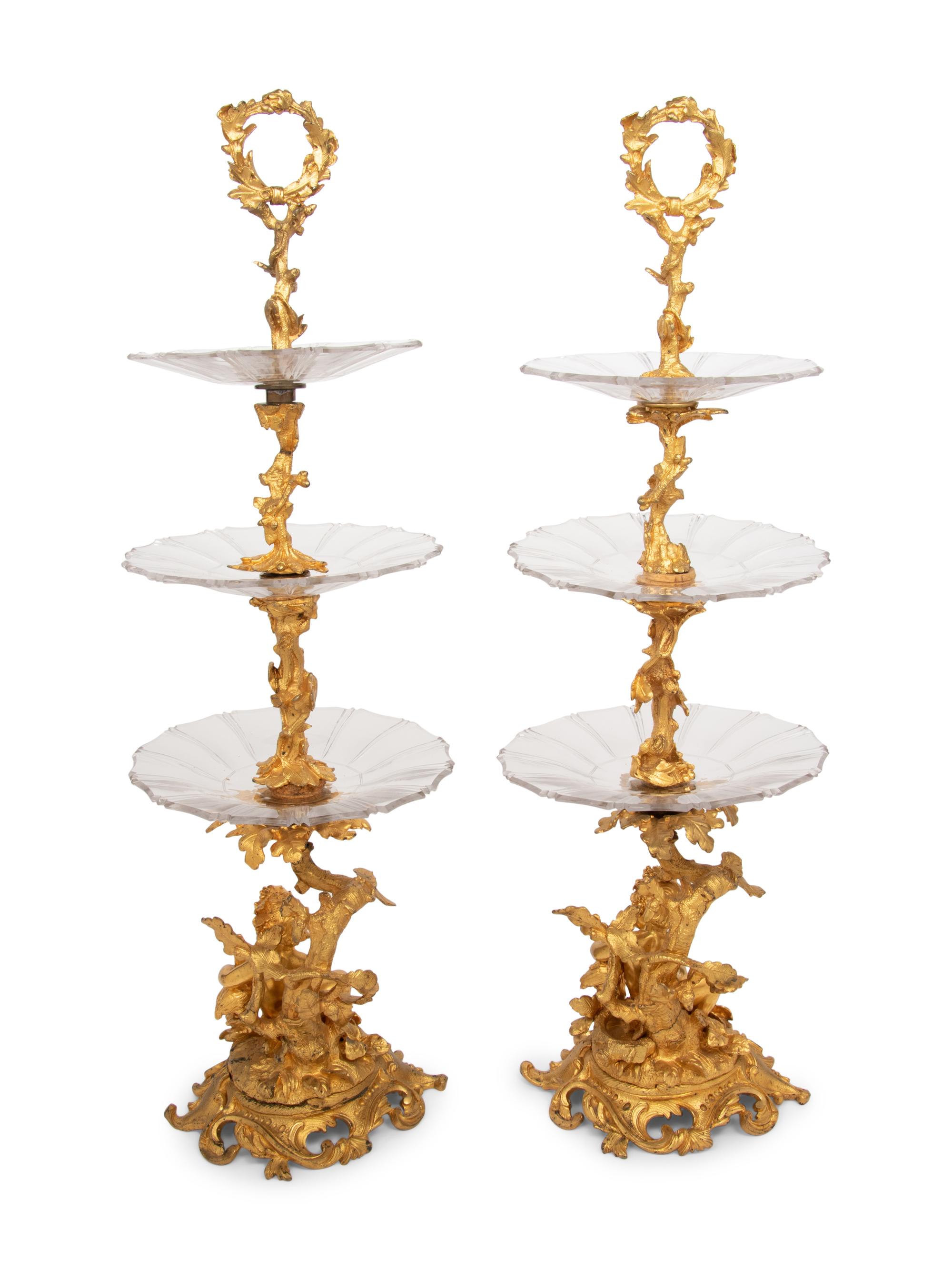 A Pair of French Gilt Bronze and Glass Three-Tier Stands