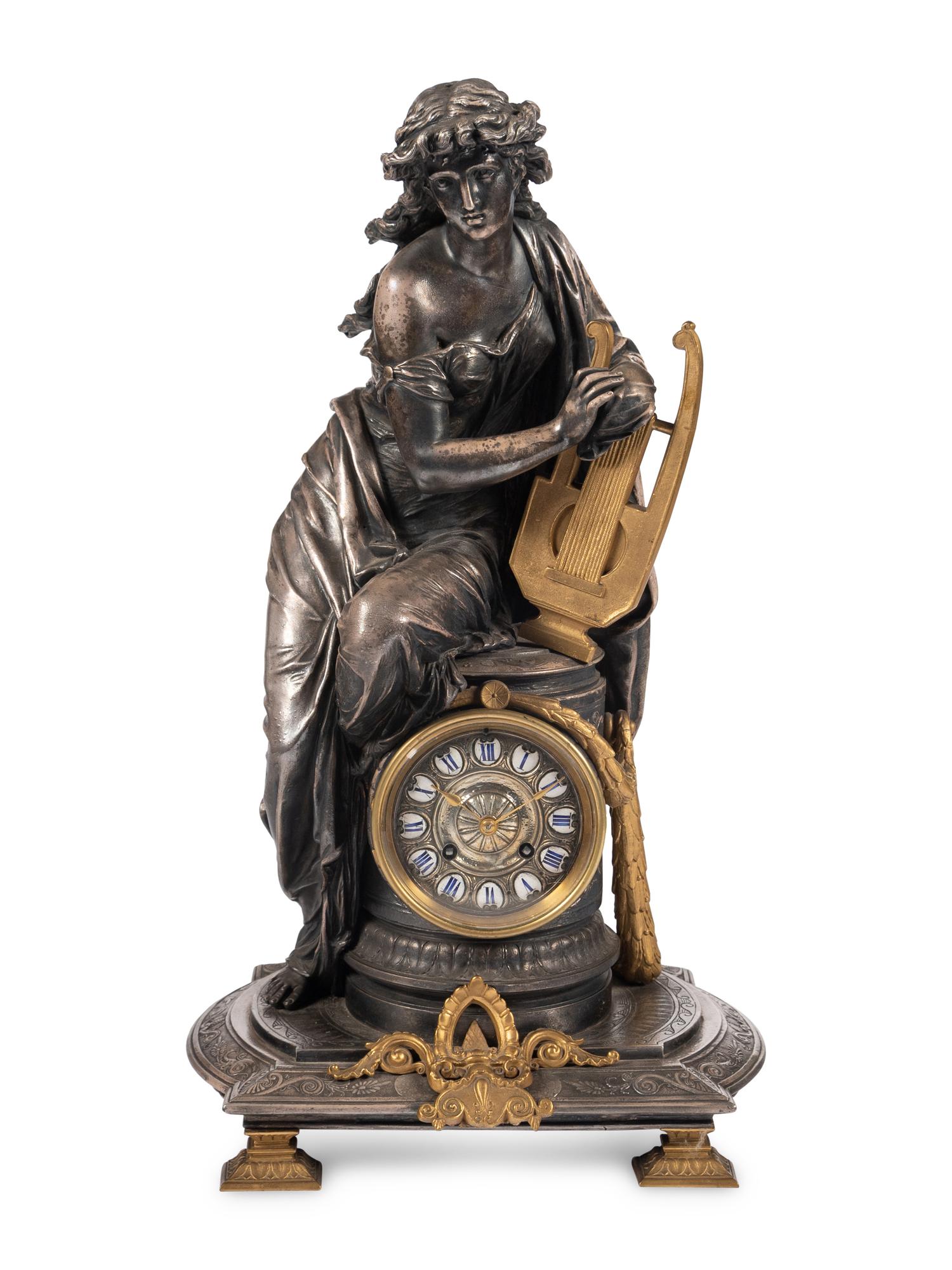 A French Gilt Bronze and Cast Metal Figural Clock
