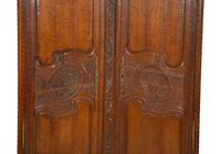 A French Provincial Carved Oak Armoire