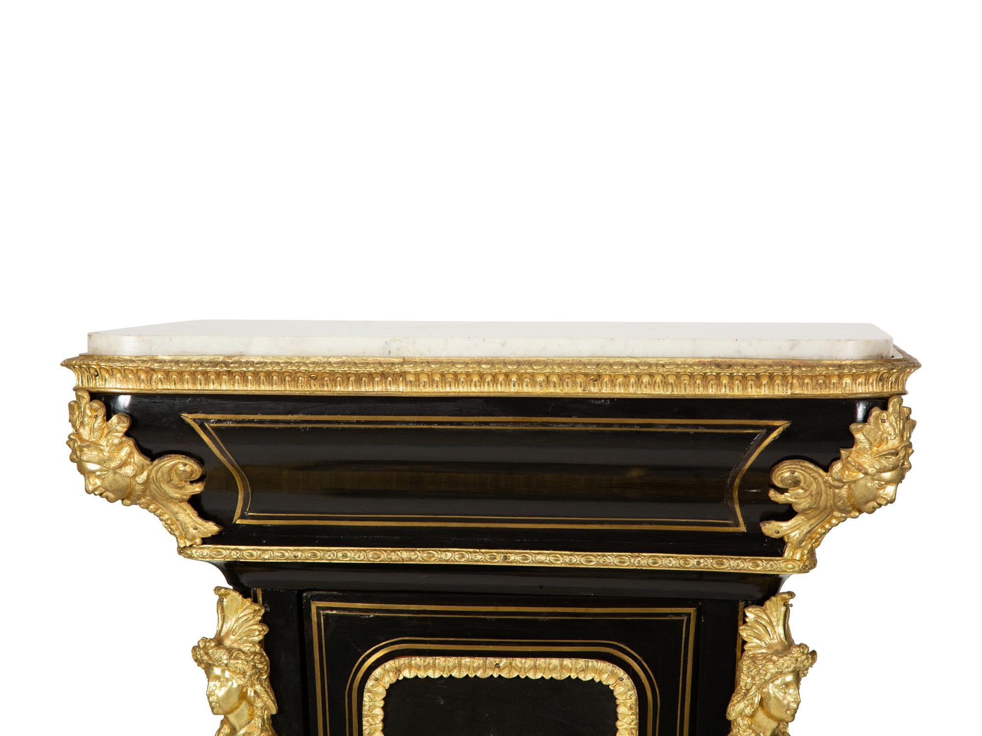 A Pair of Louis XVI Style Gilt-Bronze Mounted and Hardstone Inlaid Ebonized Marble-Top Pedestal Cabinets
