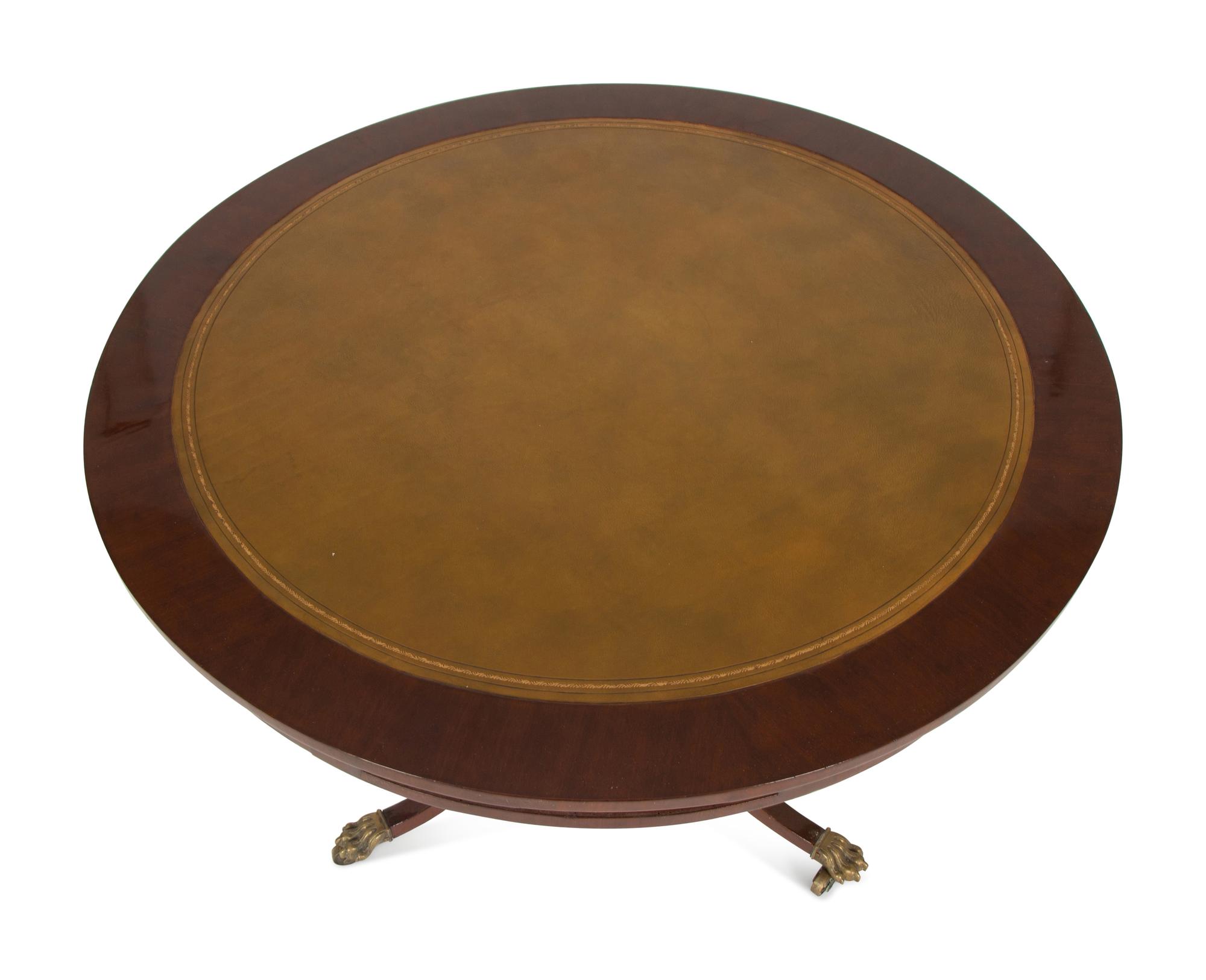 A Regency Style Mahogany Center Table with Inset Brown Leather Top — 20th Century
