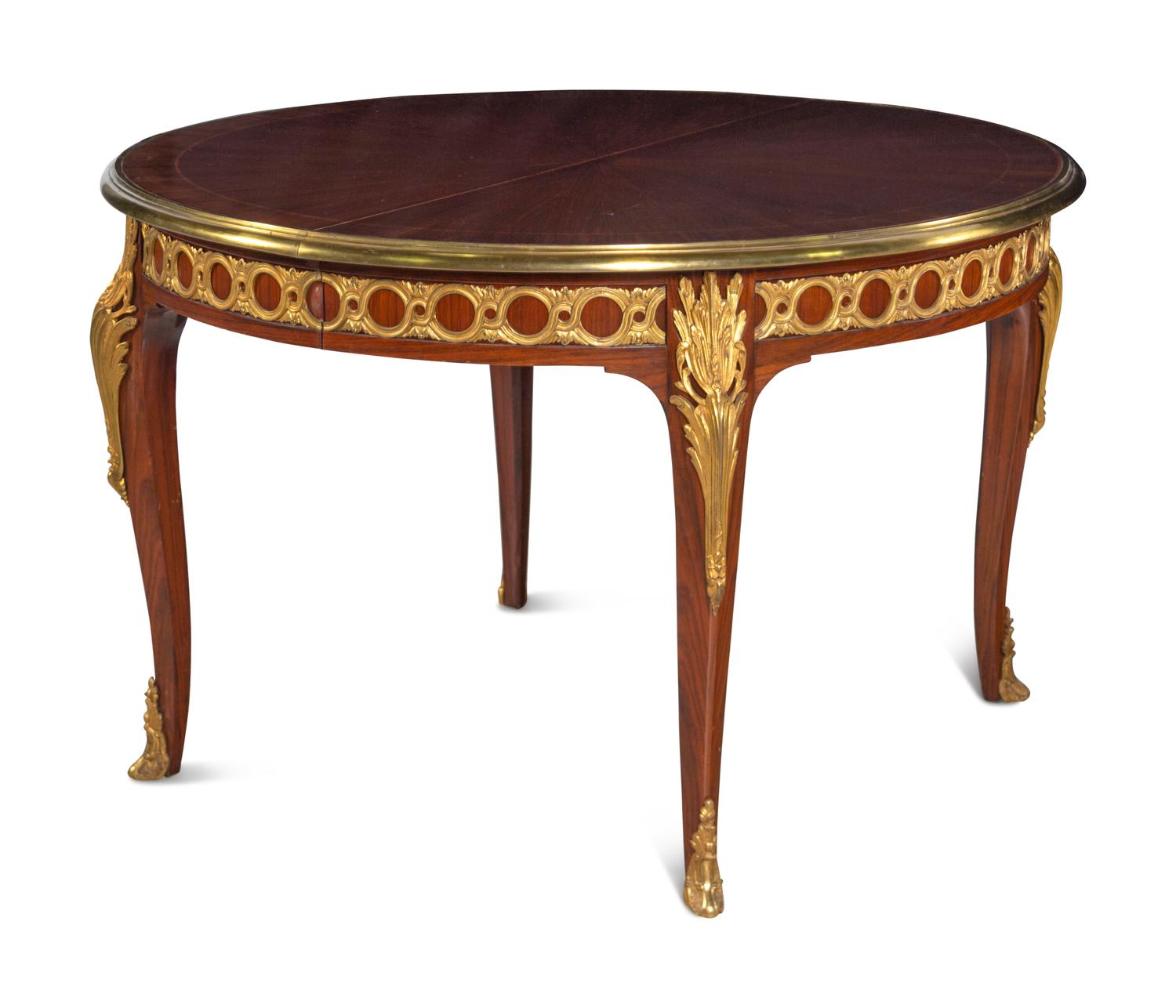 A Louis XVI Style Gilt Bronze Mounted Parquetry Dining Table