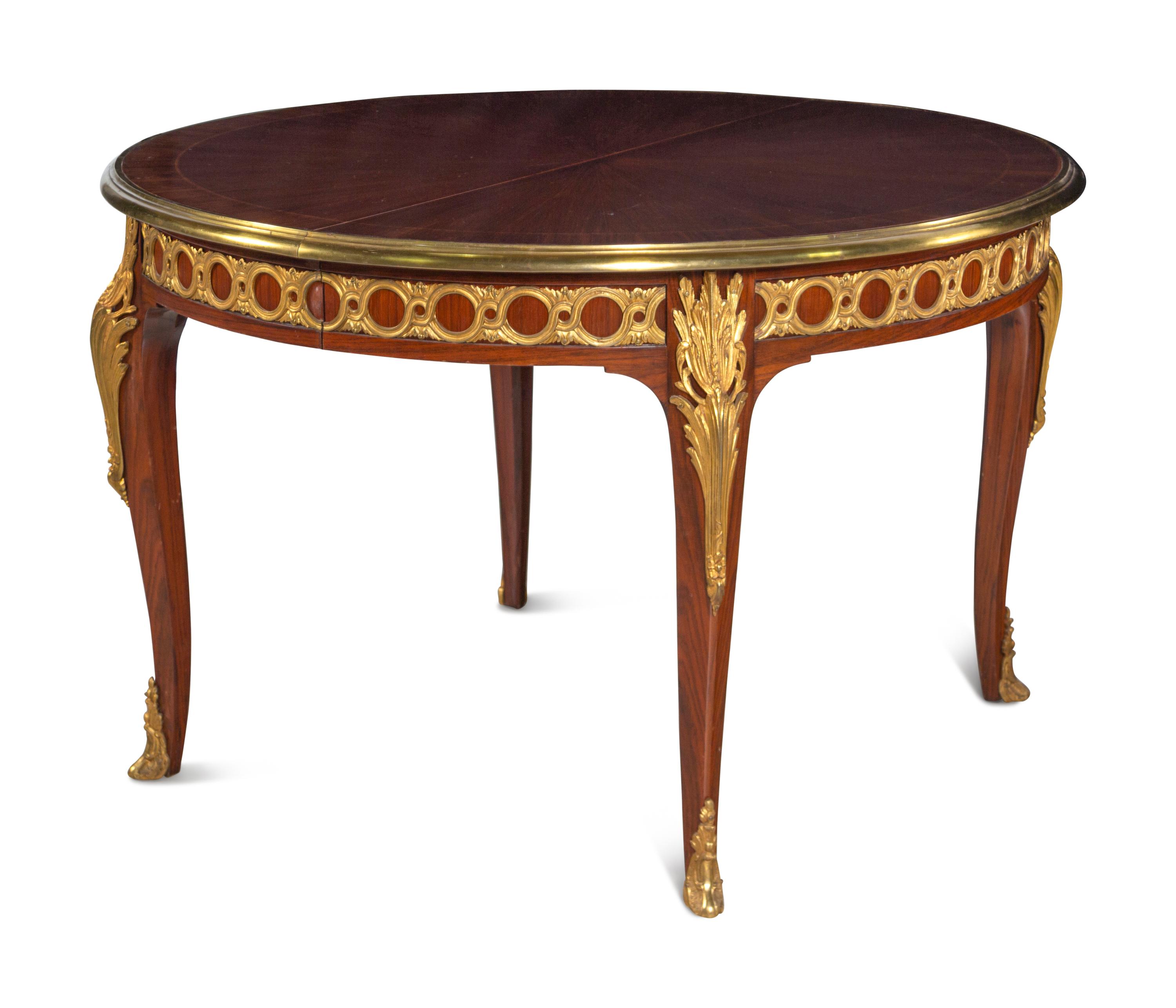 A Louis XVI Style Gilt Bronze Mounted Parquetry Dining Table