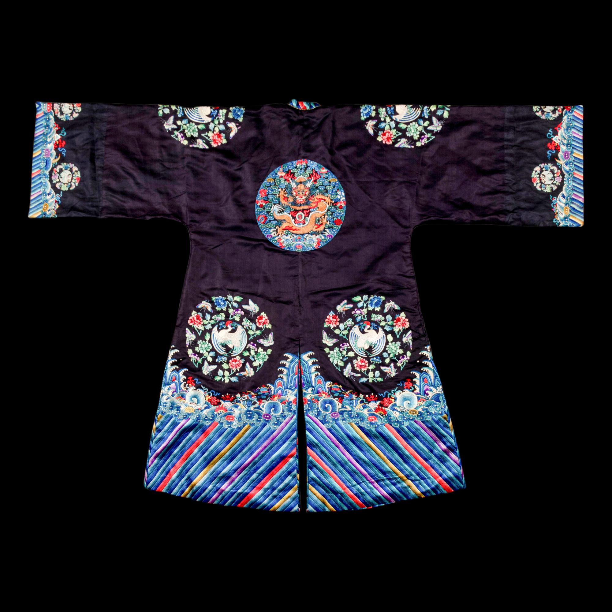 A Chinese Navy Satin Ground Embroidered Silk 'Dragon and Crane' Robe, Qiagua , Late 19th Century 清晚期 石青緞地綉龍紋團鶴紋袷褂