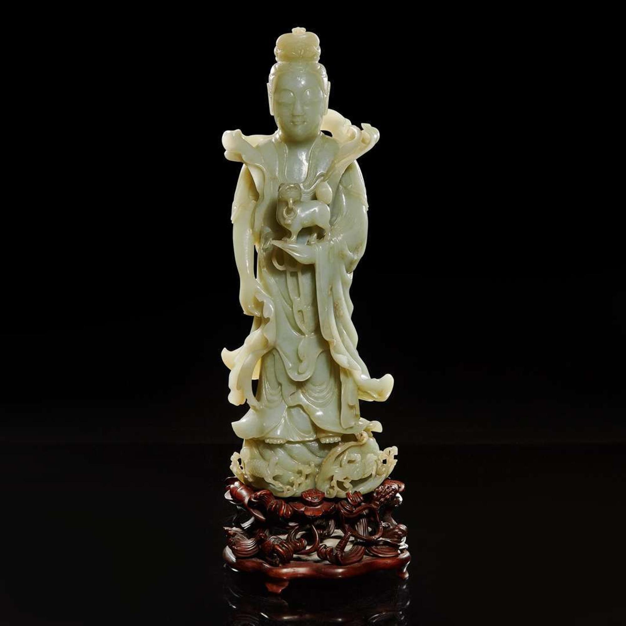 A large Chinese carved celadon jade figure of a bodhisattva 青玉雕觀音 Late Qing to Republic period ?????