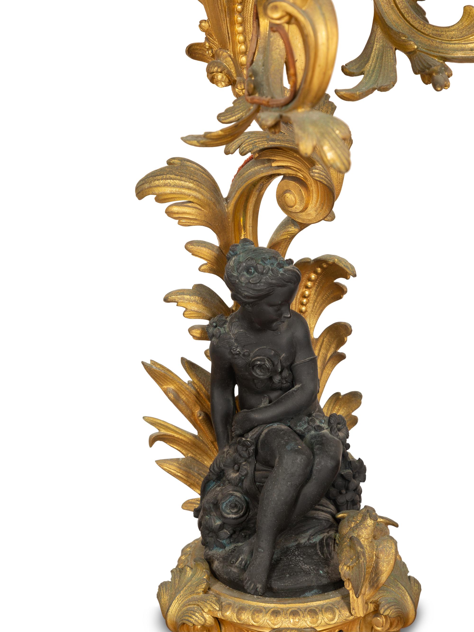 A Pair of Louis XV Style Gilt and Patinated Bronze Figural Six-Light Candelabra