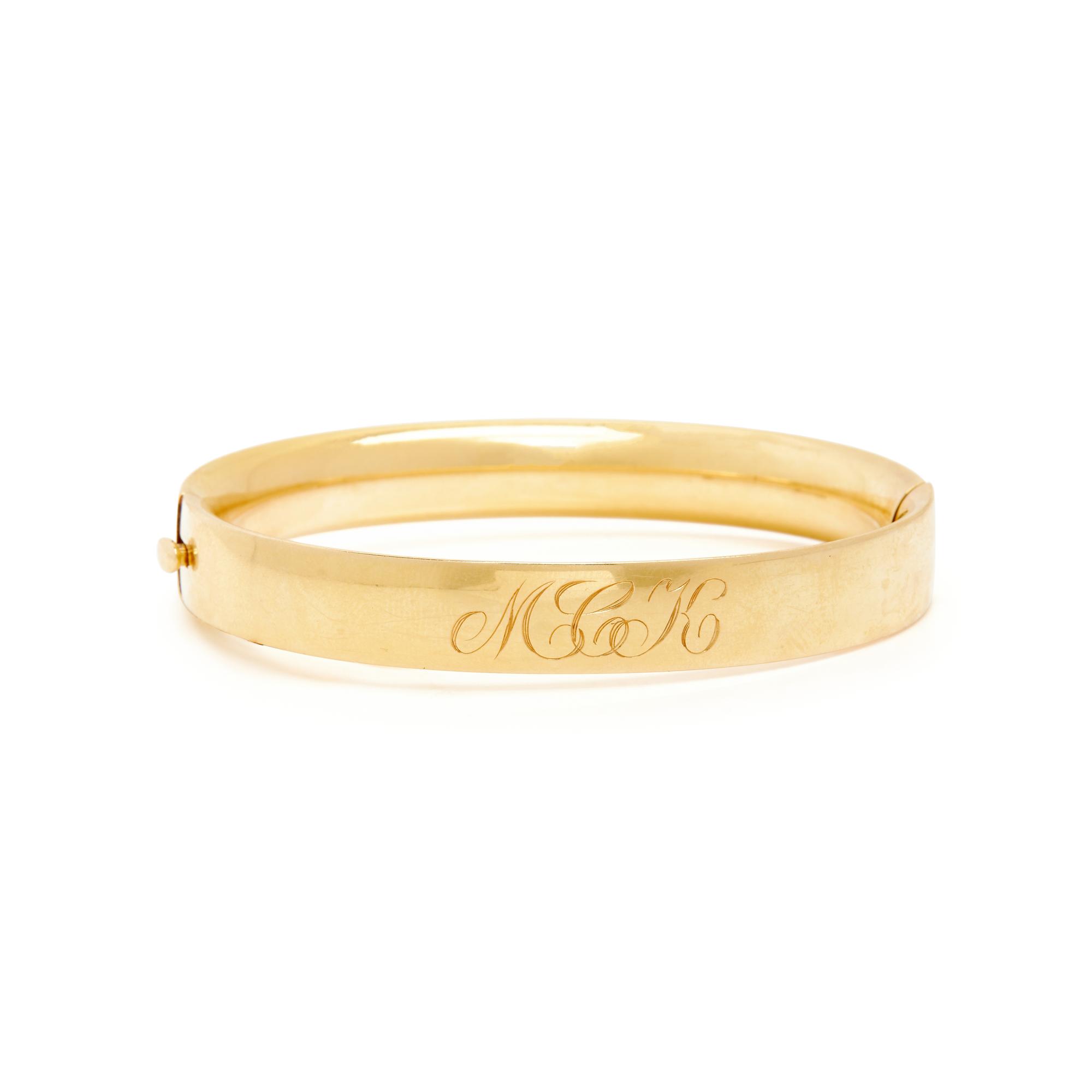 YELLOW GOLD INITIAL BROOCH AND MONOGRAMMED BANGLE