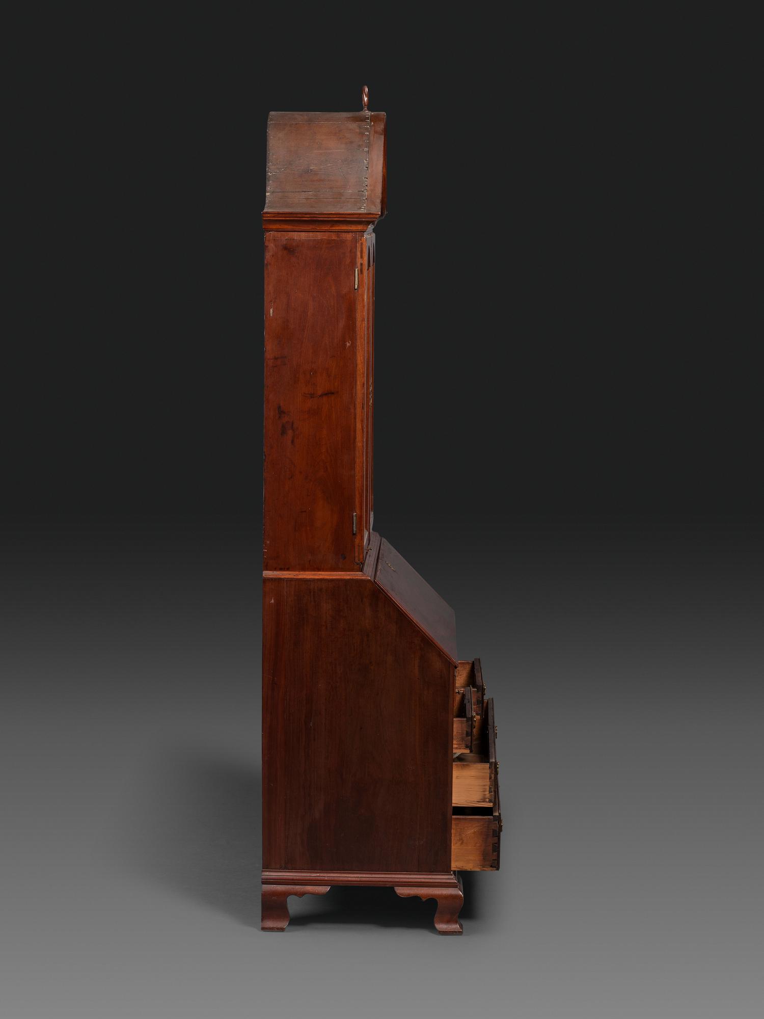 A Chippendale Figured Mahogany Bonnet Top Desk-and-Bookcase